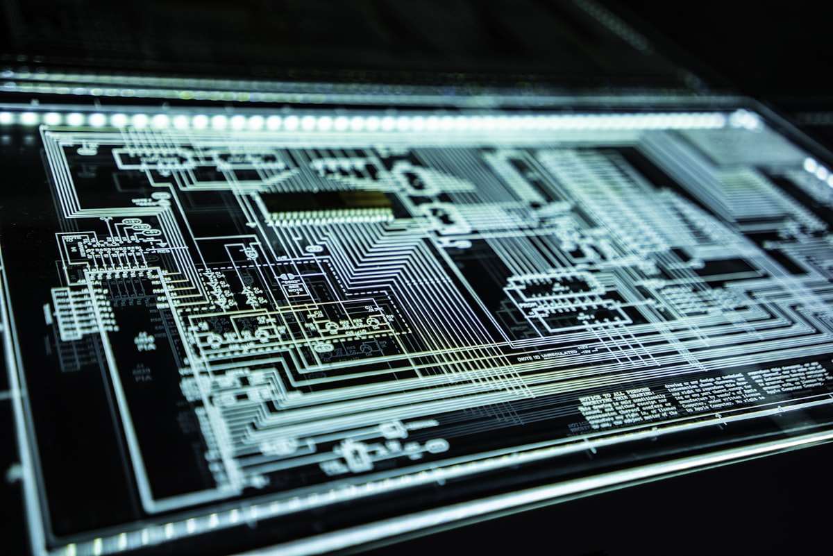 A glowing digital padlock over circuitry representing AI cyber defence